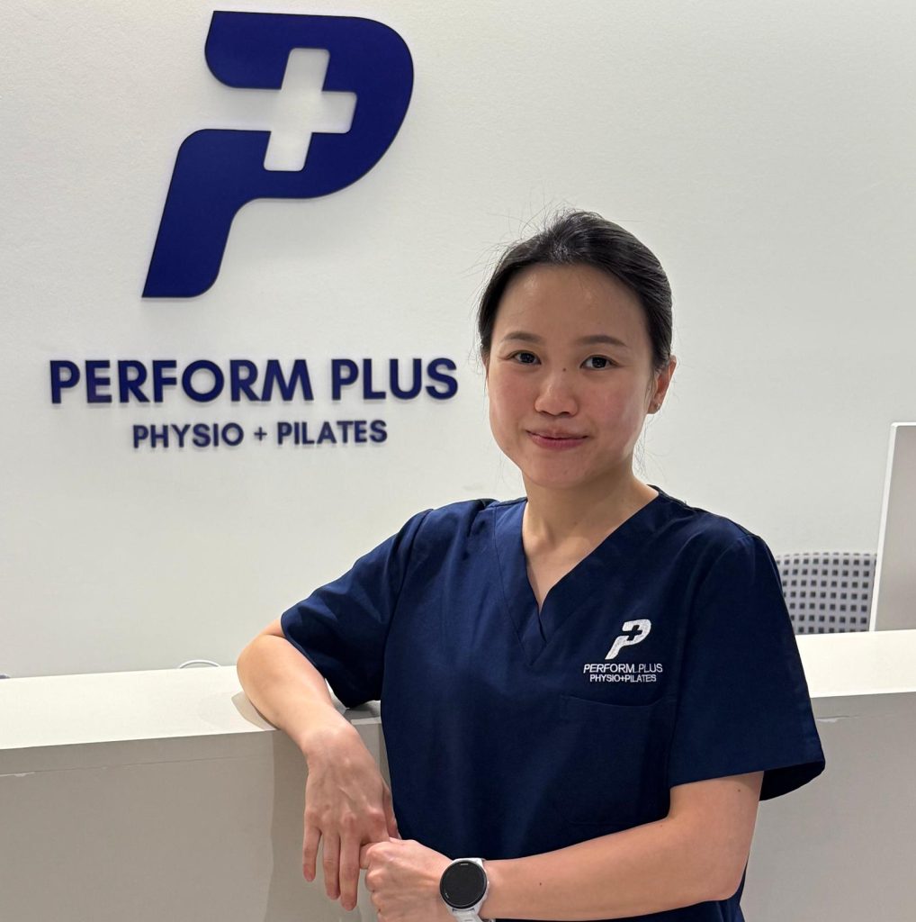 lady standing infront of sign